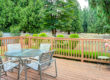 Backyard deck with table and safety railings