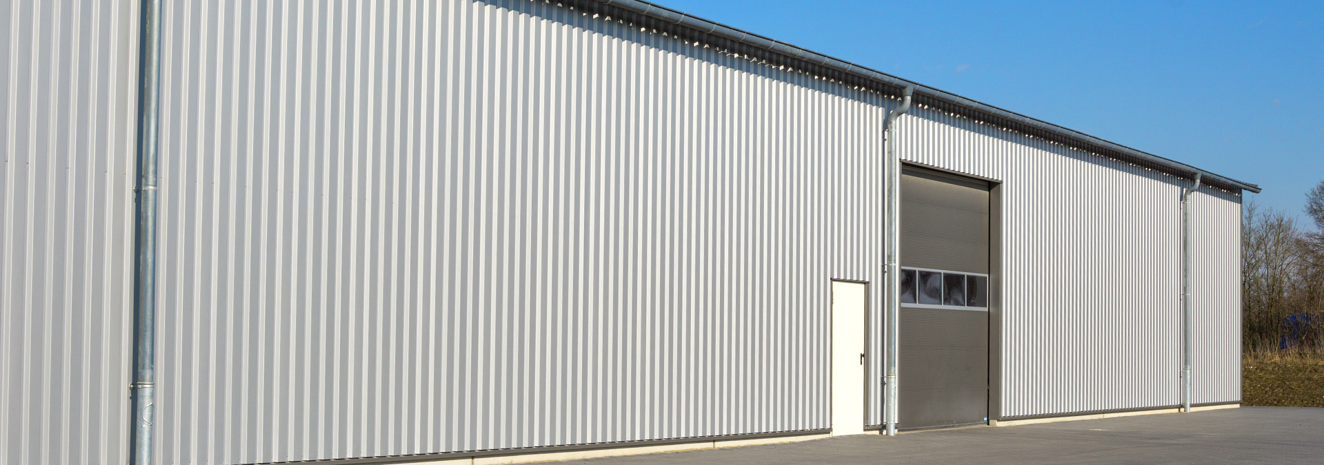 Custom metal siding on building by LBH Timber Mart