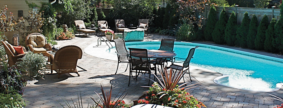 Patio set in front of pool in summer